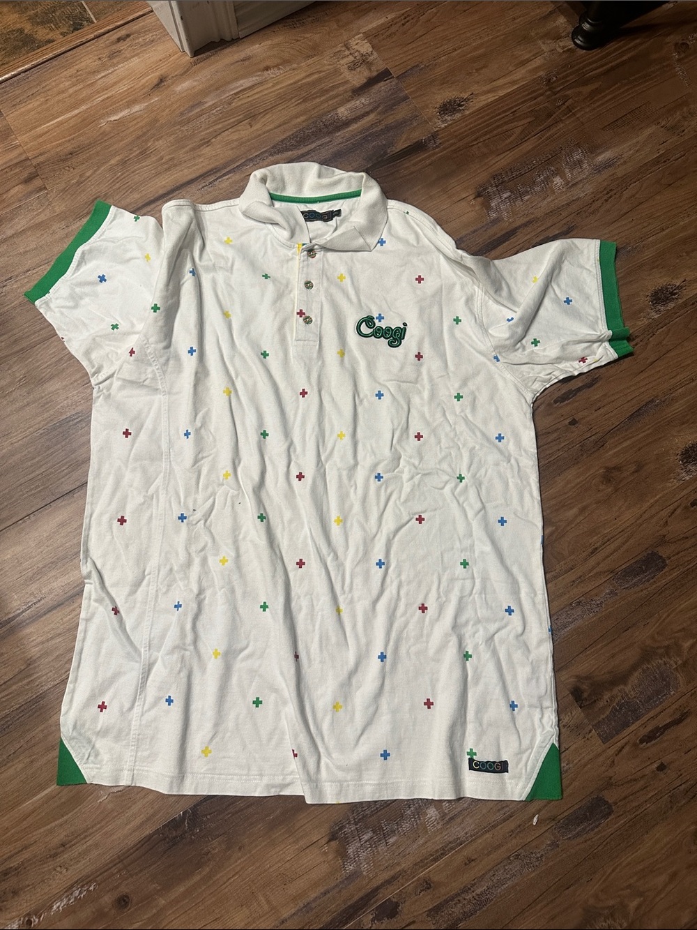 COOGI White Polo with Multicolor Cross Motif and Green Trim